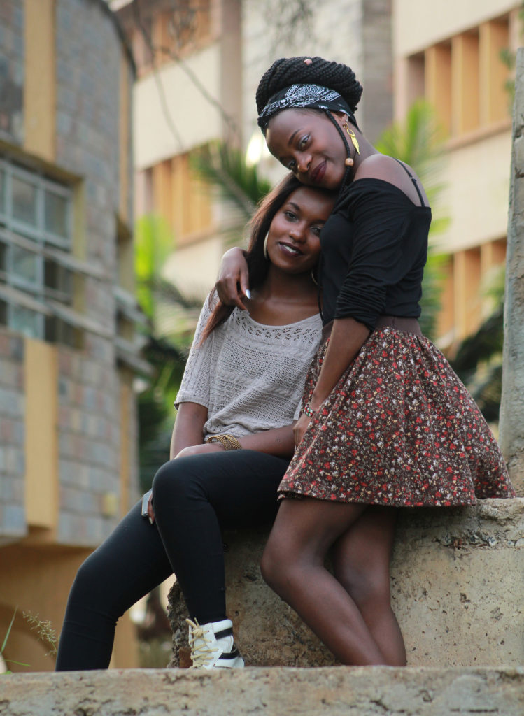 Two African American women hugging